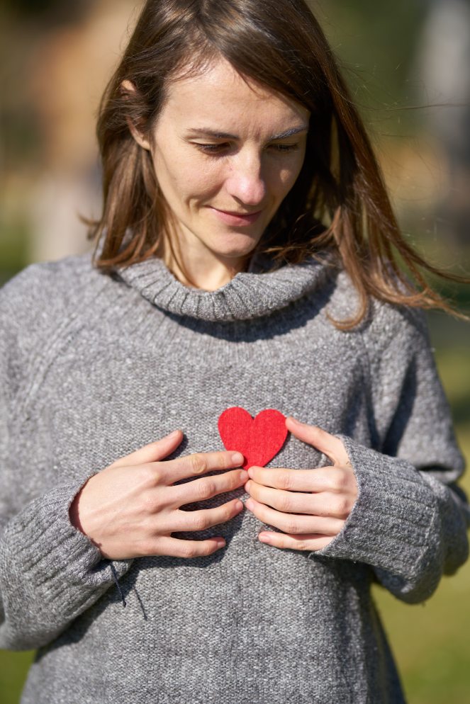 woman-holding-heart-cut-out-1820509